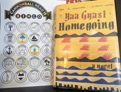 The book, "Homegoing" by Yaa Gyasi next to a partially filled out book bingo card.